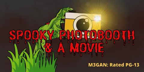zombie hand reaching out from the ground holding a yellow camera with flash