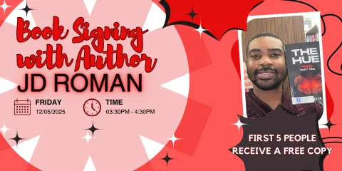 PHOTO OF J D ROMAN HOLDING A COPY OF HIS BOOK THE HUE: RED PART ONE